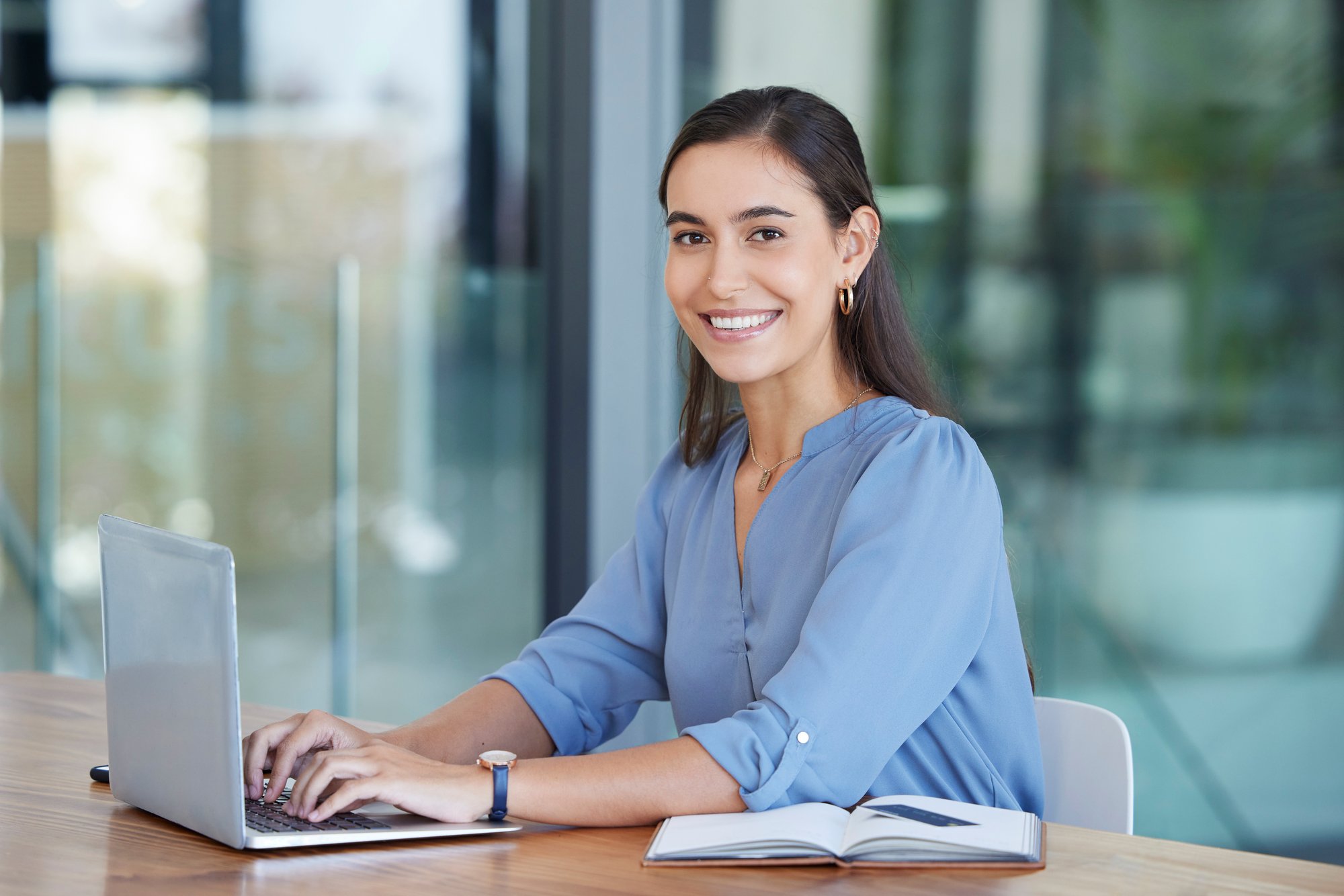 Project manager typing at desk